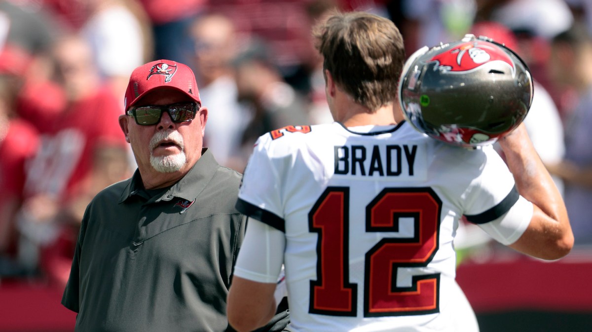 TAMPA, FLORIDA - SEPTEMBER 19: Head coach Bruce Arians and quarterback Tom Brady #12 of the Tampa Bay Buccaneers talk before the game against the Atlanta Falcons at Raymond James Stadium on September 19, 2021 in Tampa, Florida. (Photo by Douglas P. DeFelice/Getty Images)