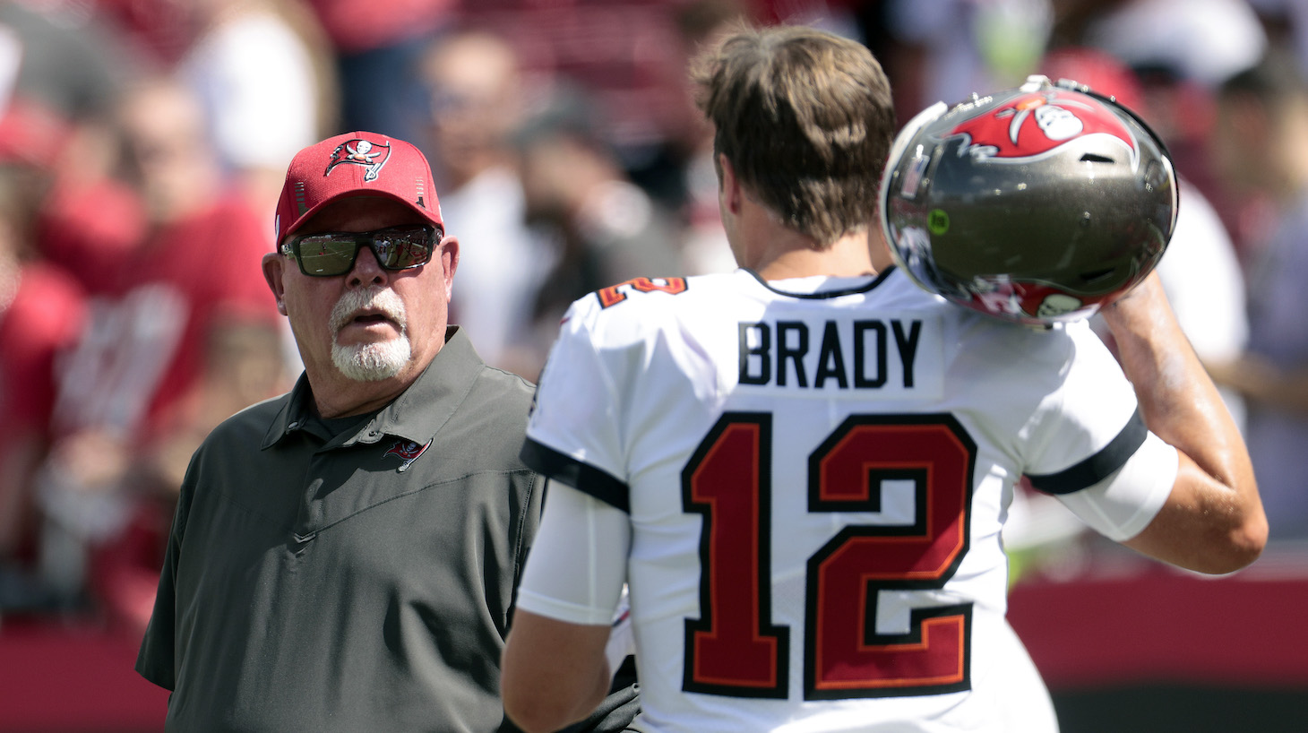 TAMPA, FLORIDA - SEPTEMBER 19: Head coach Bruce Arians and quarterback Tom Brady #12 of the Tampa Bay Buccaneers talk before the game against the Atlanta Falcons at Raymond James Stadium on September 19, 2021 in Tampa, Florida. (Photo by Douglas P. DeFelice/Getty Images)