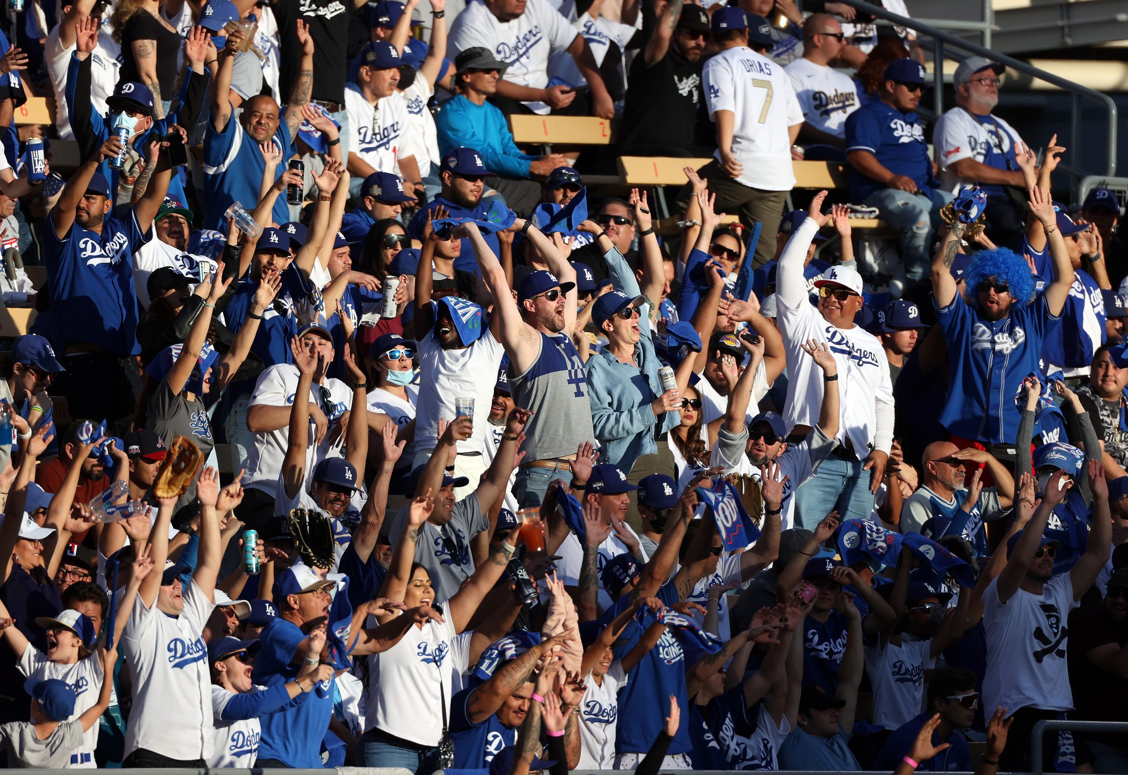 LOS ANGELES, CALIFORNIA - OCTOBER 19: Los Angeles Dodgers fans cheer during Game 3 of the National League Championship Series against the Atlanta Braves at Dodger Stadium on October 19, 2021 in Los Angeles, California.