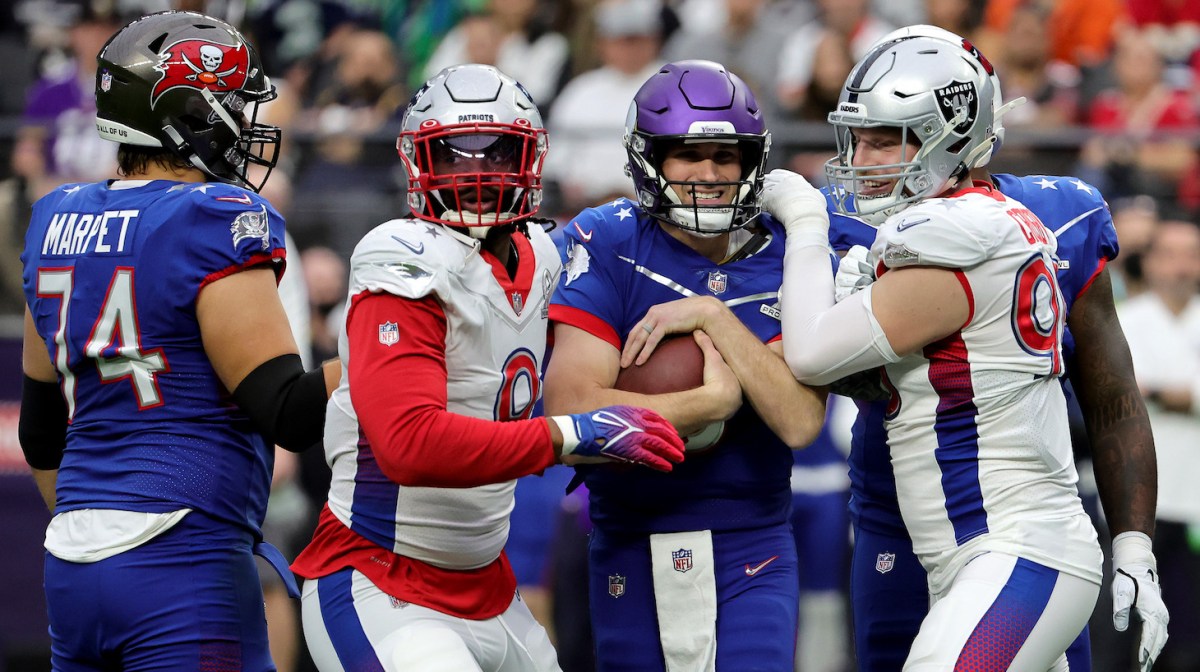 Maxx Crosby #98 of the Las Vegas Raiders and AFC sacks Kirk Cousins #8 of the Minnesota Vikings and NFC as Matthew Judon #9 of the New England Patriots and AFC defends in the second quarter of the 2022 NFL Pro Bowl at Allegiant Stadium on February 06, 2022 in Las Vegas, Nevada.