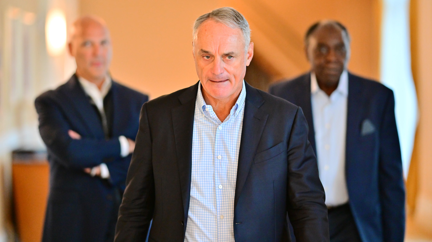 ORLANDO, FLORIDA - FEBRUARY 10: Major League Baseball Commissioner Rob Manfred walks to a press conference during an MLB owner's meeting at the Waldorf Astoria on February 10, 2022 in Orlando, Florida. Manfred addressed the ongoing lockout of players, which owners put in place after the league's collective bargaining agreement ended on December 1, 2021. (Photo by Julio Aguilar/Getty Images)