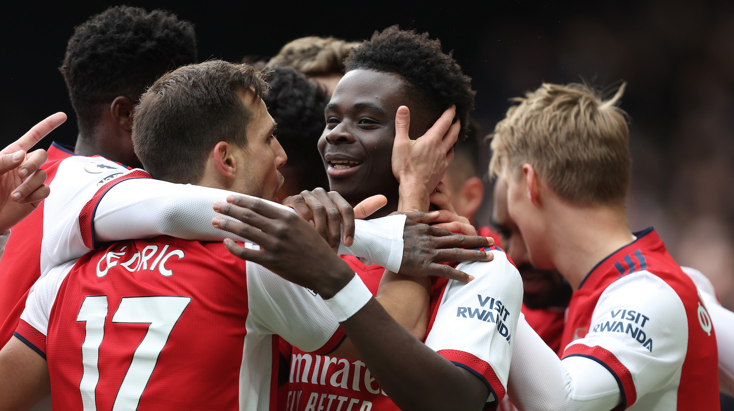 Bukayo Saka of Arsenal celebrates with (out of frame) Gabriel Martinelli of Arsenal after he scored during the Premier League match between Watford and Arsenal at Vicarage Road on March 06, 2022 in Watford, England.