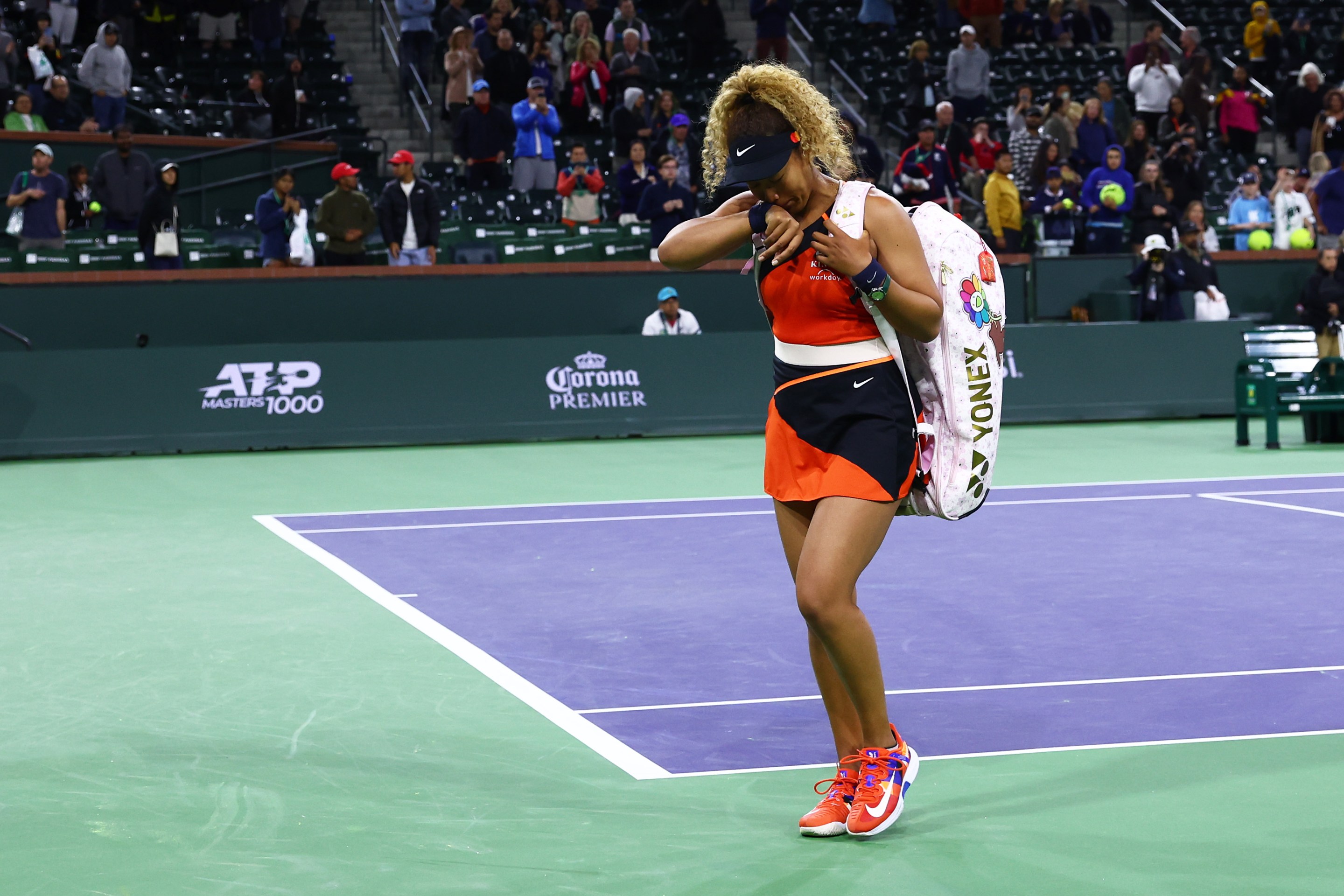 Naomi Osaka leaves the court in tears after her second-round loss at Indian Wells.