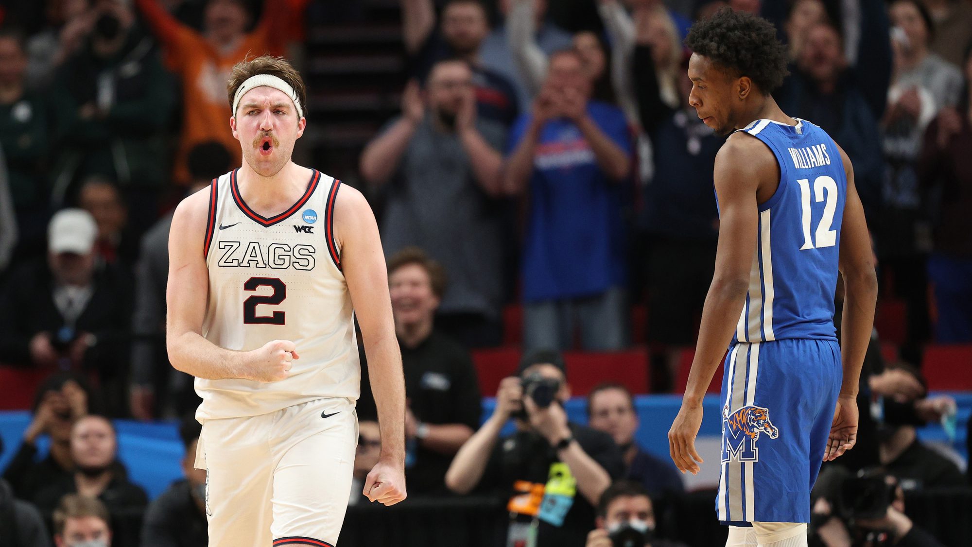 Drew Timme #2 of the Gonzaga Bulldogs reacts as DeAndre Williams #12 of the Memphis Tigers looks on after Gonzaga defeated Memphis 82-78 during the second half in the second round of the 2022 NCAA Men's Basketball Tournament at Moda Center on March 19, 2022 in Portland, Oregon.