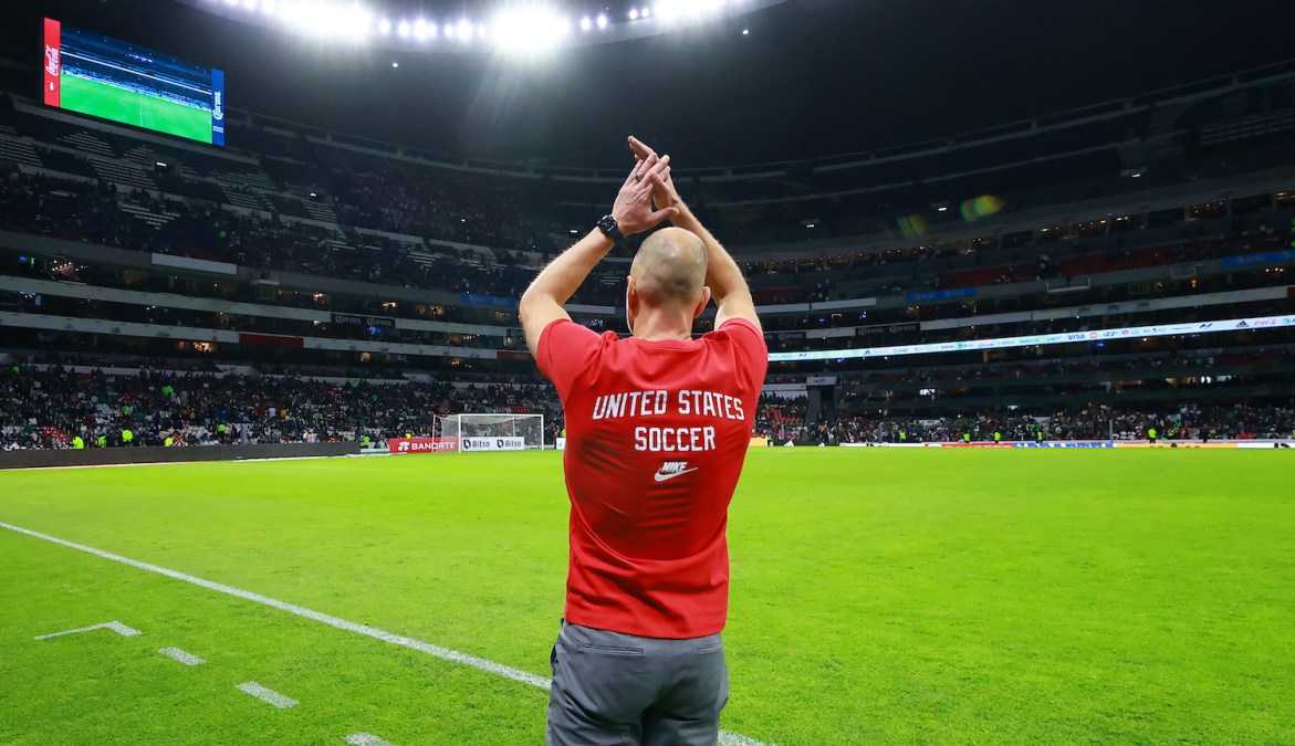 MEXICO CITY, MEXICO - MARCH 24: Gregg Berhalter, head coach of United States greets to the fans during the match between Mexico and The United States as part of the Concacaf 2022 FIFA World Cup Qualifiers at Azteca Stadium on March 24, 2022 in Mexico City, Mexico. (Photo by Hector Vivas/Getty Images)