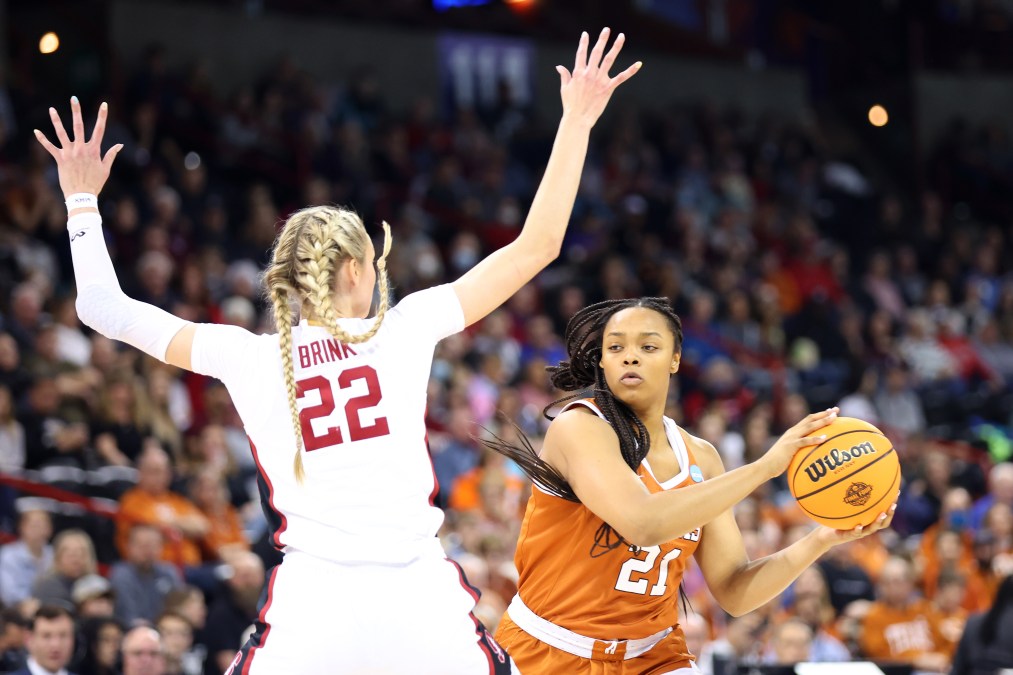 Cameron Brink #22 of the Stanford Cardinal defends against Aaliyah Moore #21 of the Texas Longhorns during the first half in the NCAA Women's Basketball Tournament Elite 8 Round at Spokane Veterans Memorial Arena on March 27, 2022 in Spokane, Washington.