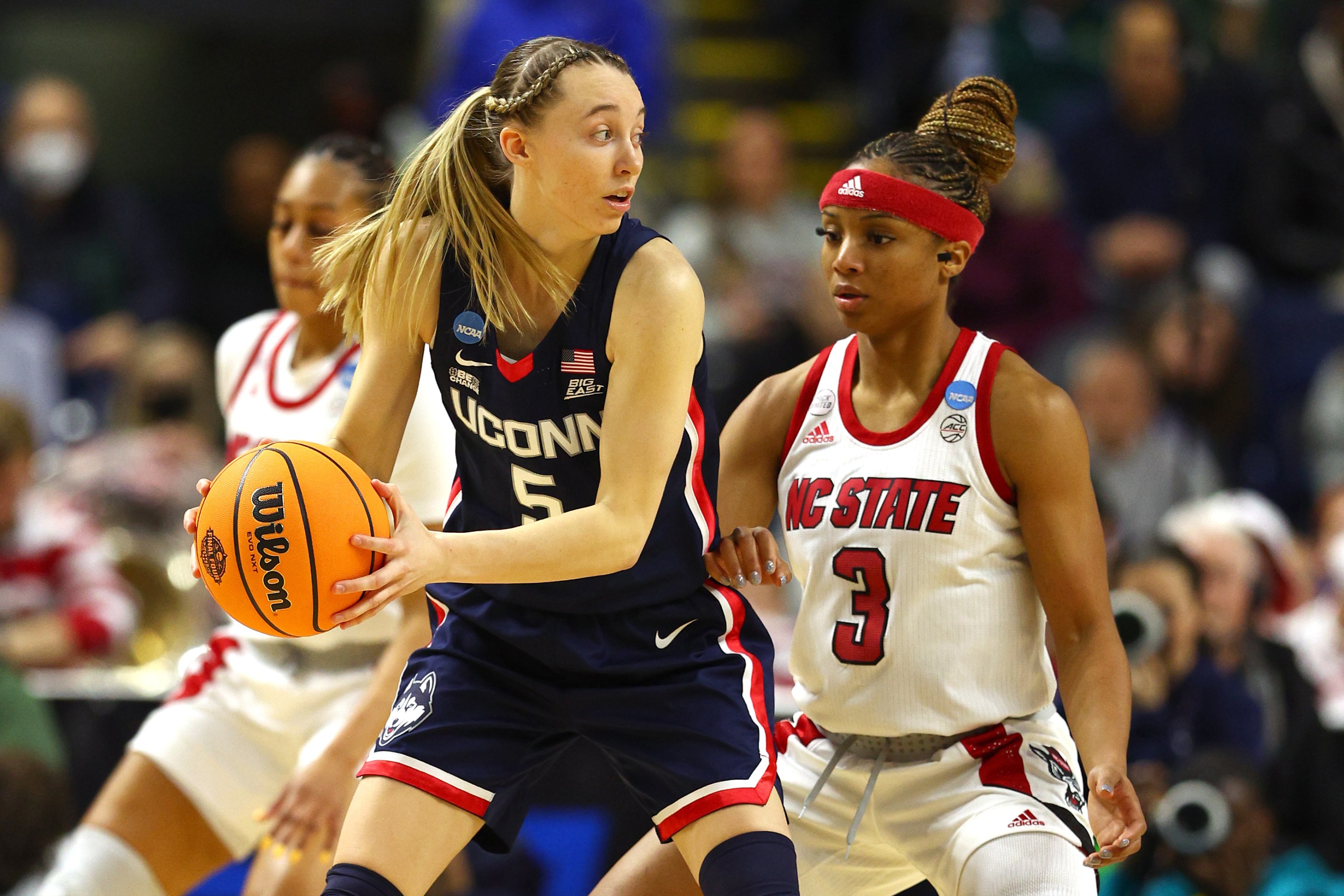 Kai Crutchfield #3 of the NC State Wolfpack defends against Paige Bueckers #5 of the UConn Huskies during the first half in the NCAA Women's Basketball Tournament Elite 8 Round at Total Mortgage Arena on March 28, 2022 in Bridgeport, Connecticut.