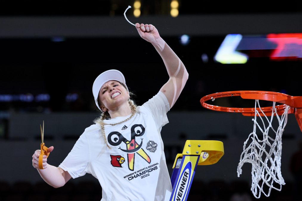 Hailey Van Lith #10 of the Louisville Cardinals cuts down the net after the 62-50 win over the Michigan Wolverines in the Elite Eight round game of the 2022 NCAA Women's Basketball Tournament at Intrust Bank Arena on March 28, 2022 in Wichita, Kansas.