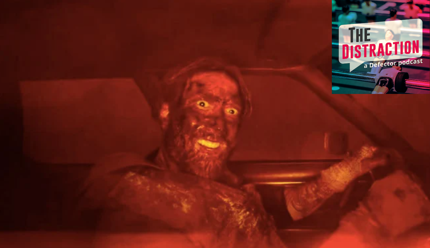Nicolas Cage in the film Mandy, covered in blood and grinning and generally seeming like himself.