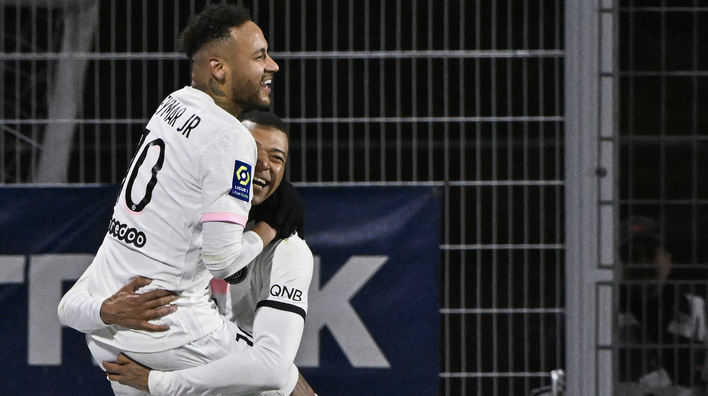 Paris Saint-Germain's Brazilian forward Neymar (L) celebrates with Paris Saint-Germain's French forward Kylian Mbappe after scoring three goals during the French L1 football match between Clermont Foot 63 and Paris Saint-Germain (PSG) at the Gabriel-Montpied stadium in Clermont-Ferrand, central France, on April 9, 2022.