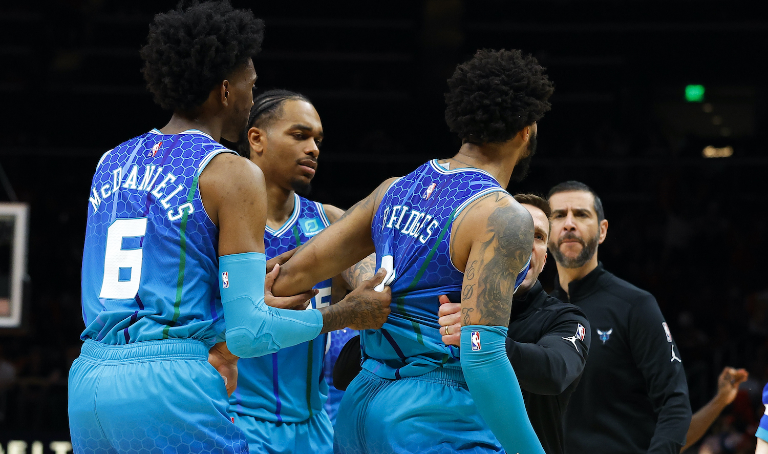 ATLANTA, GA - APRIL 13: Miles Bridges #0 of the Charlotte Hornets is restrained after a foul is called and he is ejected during the second half against the Atlanta Hawks at State Farm Arena on April 13, 2022 in Atlanta, Georgia. NOTE TO USER: User expressly acknowledges and agrees that, by downloading and or using this photograph, User is consenting to the terms and conditions of the Getty Images License Agreement. (Photo by Todd Kirkland/Getty Images) *** Local Caption *** Miles Bridges