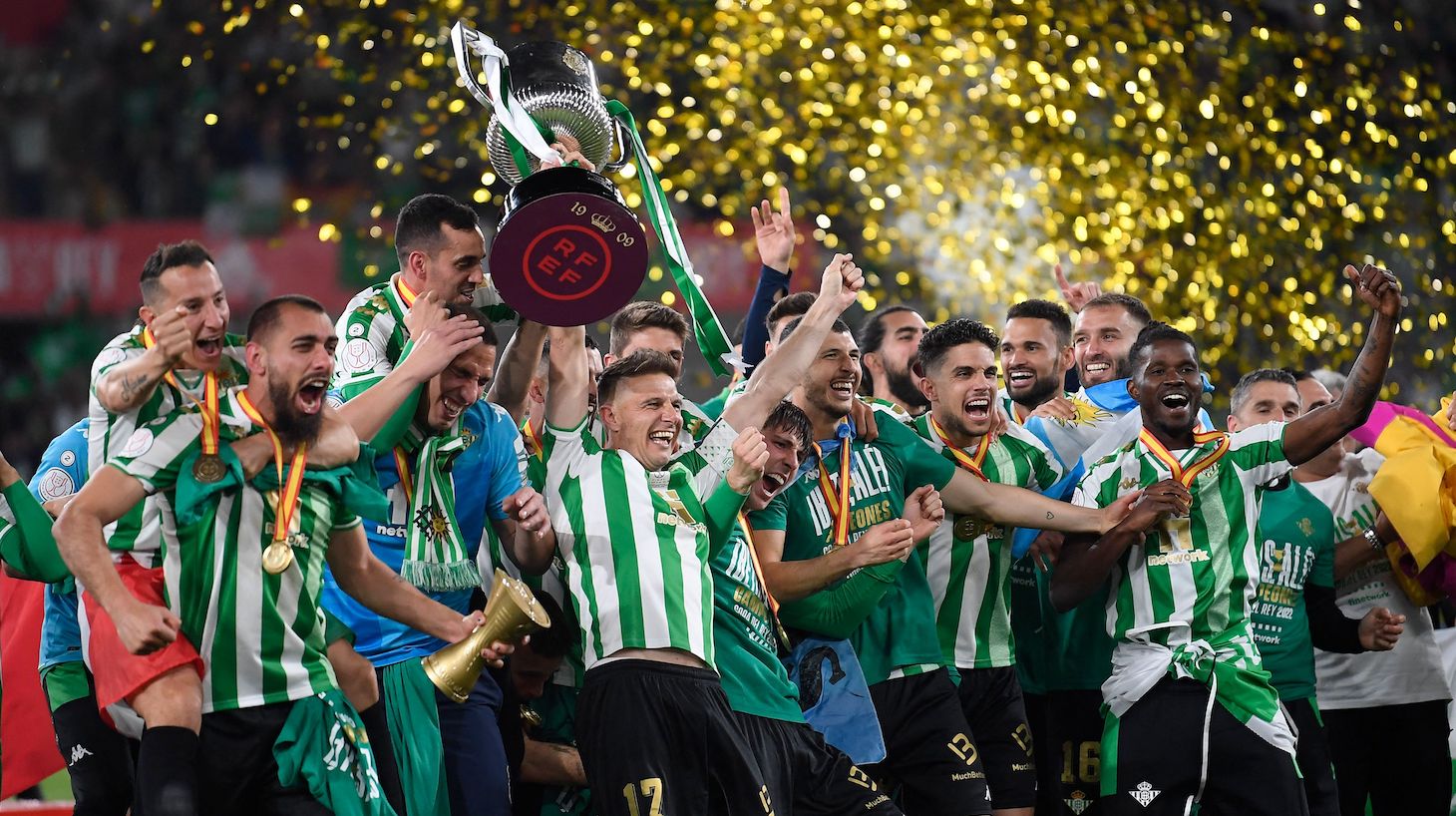 Real Betis' Spanish midfielder Joaquin raises the winner's trophy as he celebrates with teammates their victory after winning the Spanish Copa del Rey (King's Cup) final football match between Real Betis and Valencia CF at La Cartuja Stadium in Seville, on April 23, 2022.