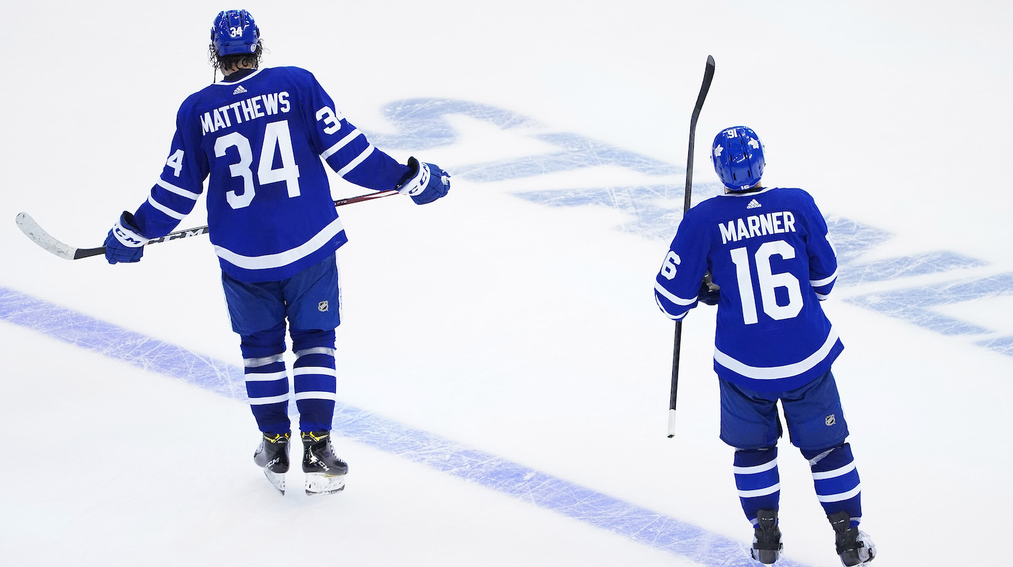 TORONTO, ONTARIO - AUGUST 09: Auston Matthews #34 and Mitchell Marner #16 of the Toronto Maple Leafs look on following their lose to the Columbus Blue Jackets 3-0 in Game Five of the Eastern Conference Qualification Round prior to the 2020 NHL Stanley Cup Playoffs at Scotiabank Arena on August 09, 2020 in Toronto, Ontario. (Photo by Andre Ringuette/Freestyle Photo/Getty Images)