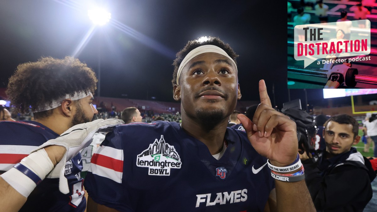 Malik Willis seen pointing upwards after the LendingTree Bowl, a real event.