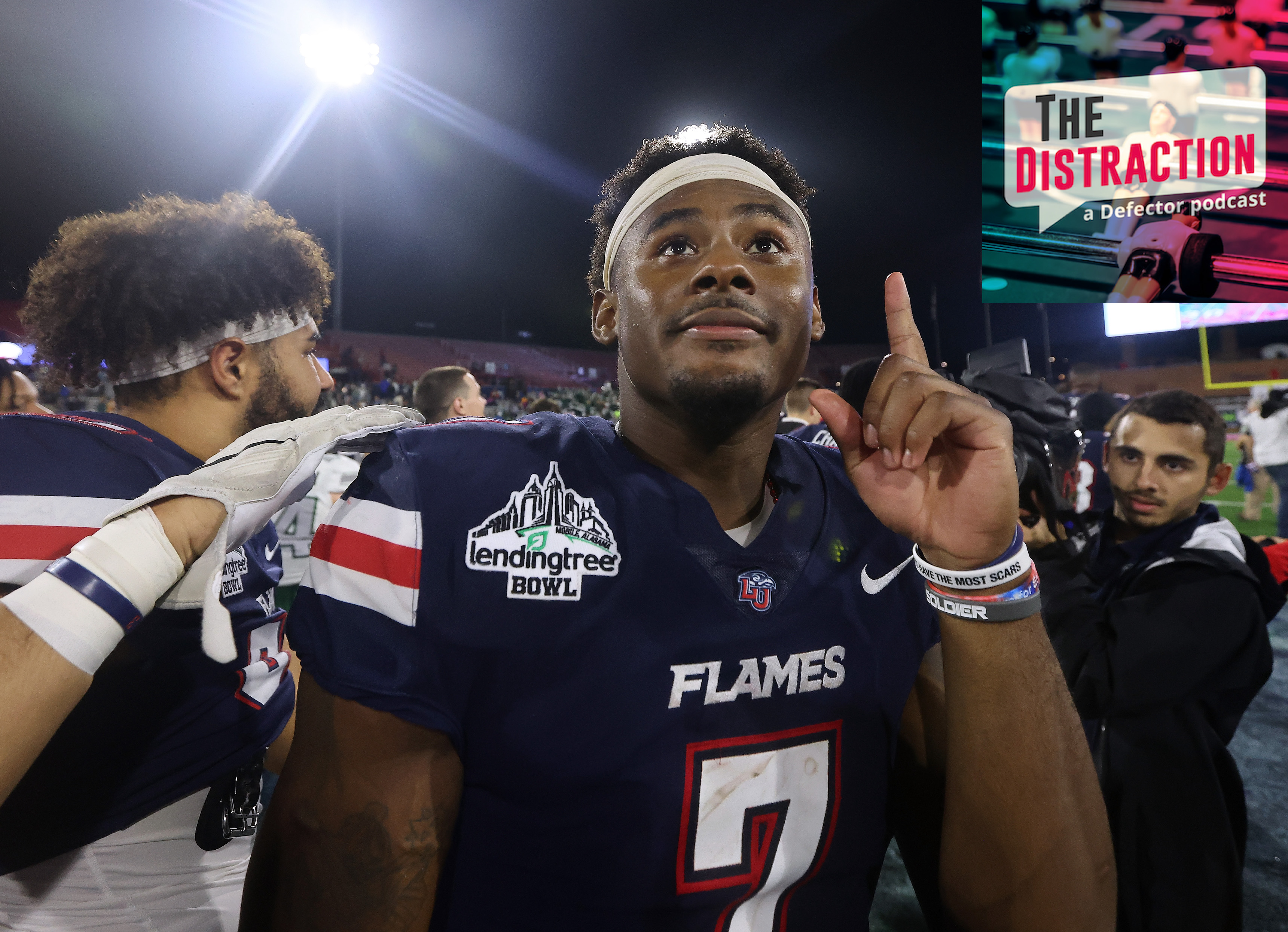 Malik Willis seen pointing upwards after the LendingTree Bowl, a real event.
