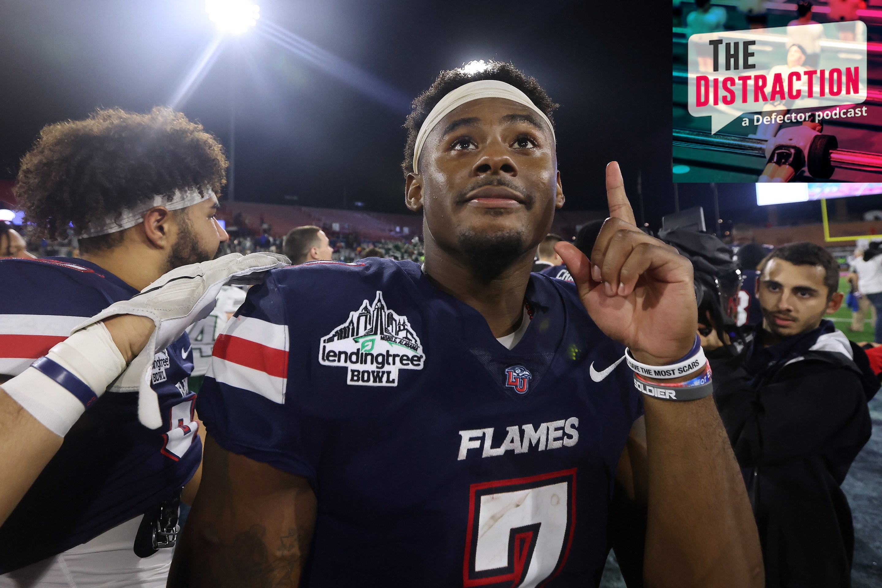 Malik Willis seen pointing upwards after the LendingTree Bowl, a real event.