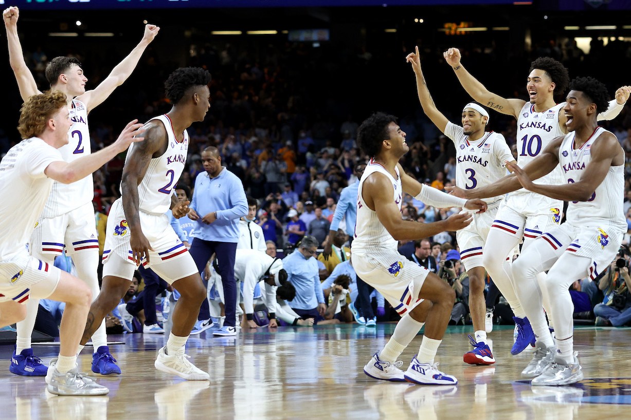 NEW ORLEANS, LOUISIANA - APRIL 04: The Kansas Jayhawks celebrate after defeating the North Carolina Tar Heels 72-69 during the 2022 NCAA Men's Basketball Tournament National Championship at Caesars Superdome on April 04, 2022 in New Orleans, Louisiana. (Photo by Jamie Squire/Getty Images)