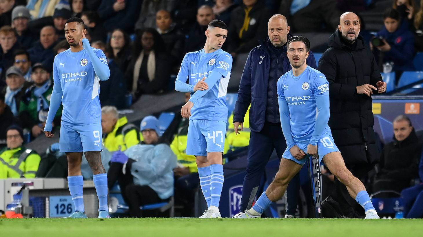 Gabriel Jesus, Phil Foden and Jack Grealish of Manchester City prepare to come on during the UEFA Champions League Quarter Final Leg One match between Manchester City and Atletico Madrid at City of Manchester Stadium on April 05, 2022 in Manchester, England.
