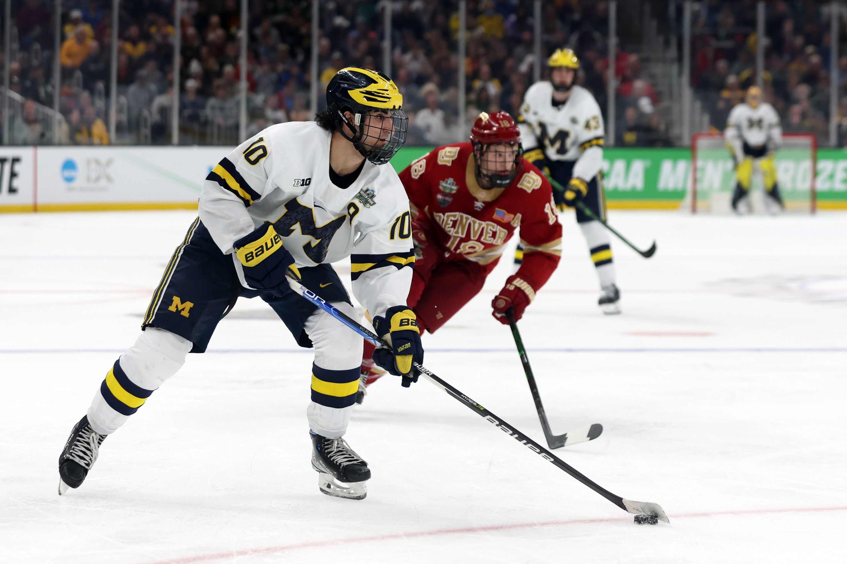 BOSTON, MASSACHUSETTS - APRIL 07: Matty Beniers #10 of the Michigan skates during the third period of the Frozen Four semifinal game between the Michigan Wolverines and Denver Pioneers at TD Garden on April 07, 2022 in Boston, Massachusetts.