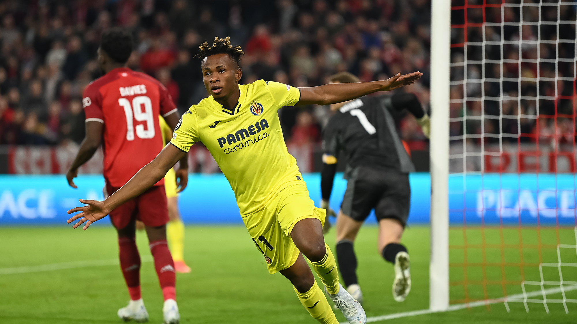 Samu Chukwueze of Villareal celebrates after scoring his team`s first goal during the UEFA Champions League Quarter Final Leg Two match between Bayern München and Villarreal CF at Football Arena Munich on April 12, 2022 in Munich, Germany.