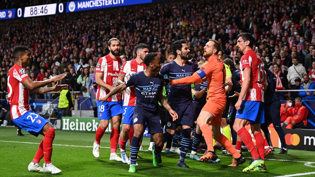 Raheem Sterling of Manchester City clashes with Reinildo Mandava of Atletico Madrid during the UEFA Champions League Quarter Final Leg Two match between Atlético Madrid and Manchester City at Wanda Metropolitano on April 13, 2022 in Madrid, Spain.