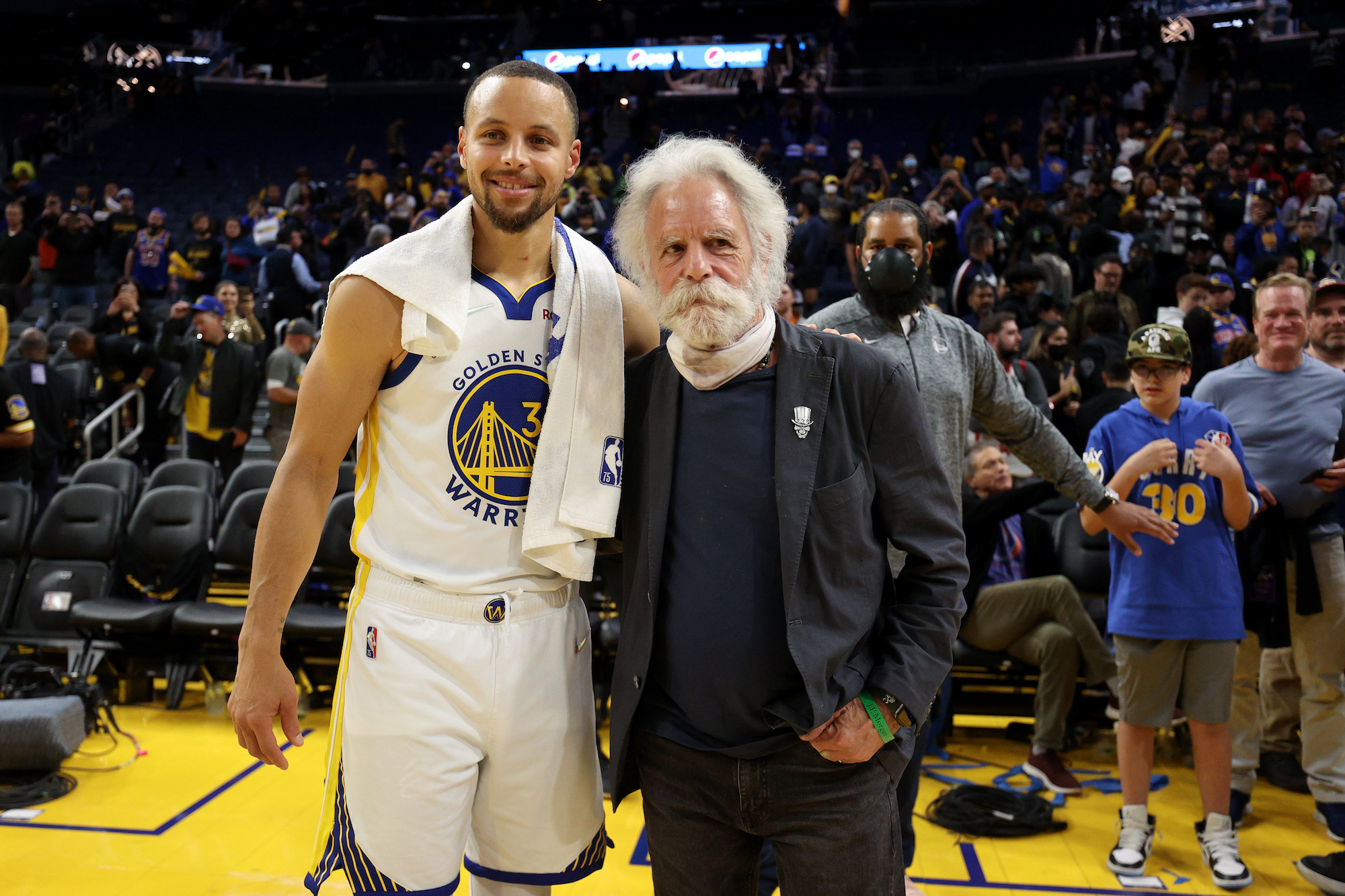 SAN FRANCISCO, CALIFORNIA - APRIL 18: Stephen Curry #30 of the Golden State Warriors poses for a picture with Grateful Dead musician Bob Weir following Game Two of the Western Conference First Round NBA Playoffs against the Denver Nuggets at Chase Center on April 18, 2022 in San Francisco, California. NOTE TO USER: User expressly acknowledges and agrees that, by downloading and/or using this photograph, User is consenting to the terms and conditions of the Getty Images License Agreement. (Photo by Ezra Shaw/Getty Images)
