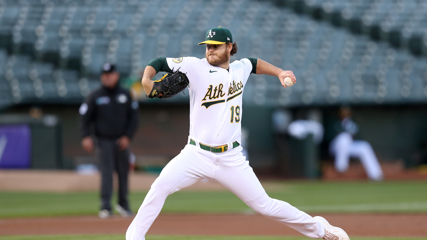 OAKLAND, CALIFORNIA - APRIL 19: Cole Irvin #19 of the Oakland Athletics pitches against the Baltimore Orioles in the first inning at RingCentral Coliseum on April 19, 2022 in Oakland, California. (Photo by Ezra Shaw/Getty Images)