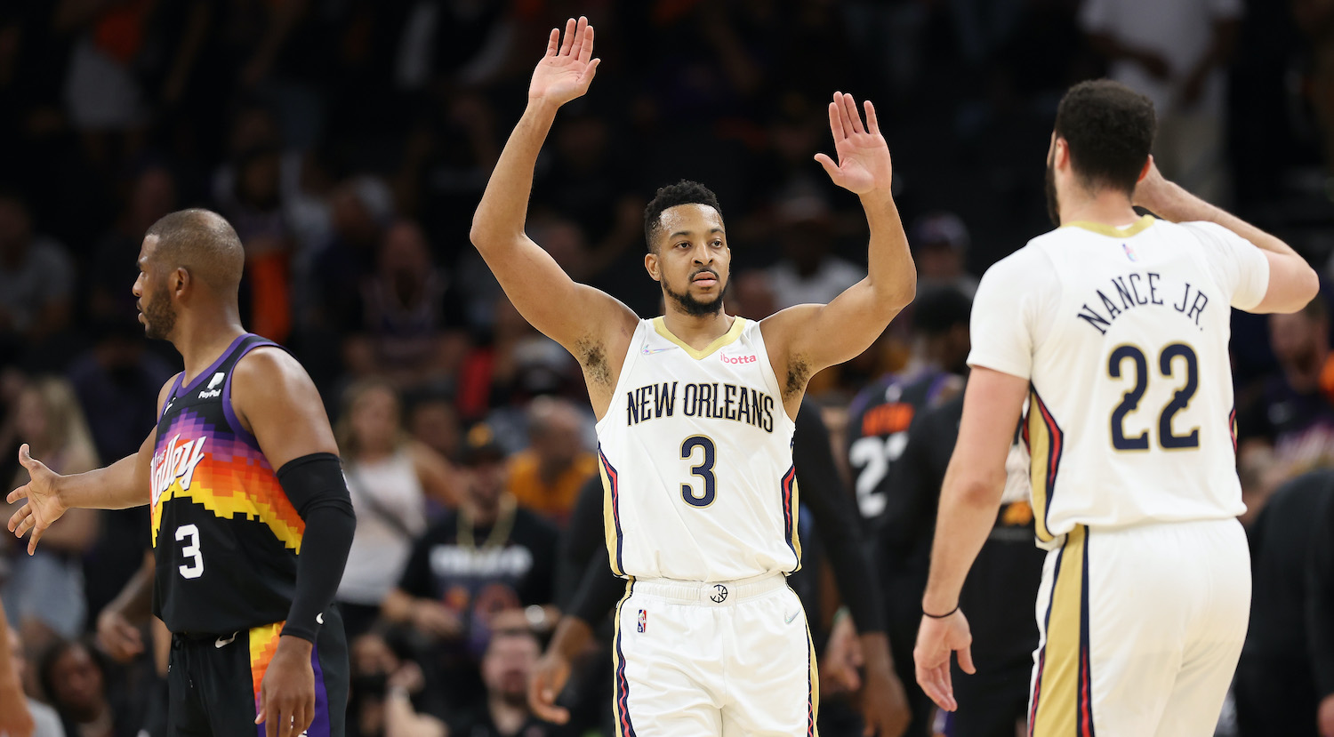 PHOENIX, ARIZONA - APRIL 19: CJ McCollum #3 of the New Orleans Pelicans celebrates with Larry Nance Jr. #22 following Game Two of the Western Conference First Round NBA Playoffs at Footprint Center on April 19, 2022 in Phoenix, Arizona. The Pelicans defeated the Suns 125-114. NOTE TO USER: User expressly acknowledges and agrees that, by downloading and or using this photograph, User is consenting to the terms and conditions of the Getty Images License Agreement. (Photo by Christian Petersen/Getty Images)