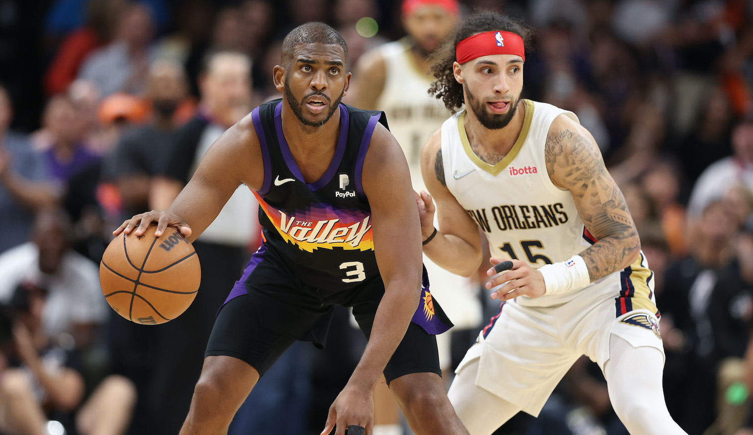 PHOENIX, ARIZONA - APRIL 26: Chris Paul #3 of the Phoenix Suns handles the ball against Jose Alvarado #15 of the New Orleans Pelicans during the second half of Game Five of the Western Conference First Round NBA Playoffs at Footprint Center on April 26, 2022 in Phoenix, Arizona. The Suns defeated the Pelicans 112-97. NOTE TO USER: User expressly acknowledges and agrees that, by downloading and or using this photograph, User is consenting to the terms and conditions of the Getty Images License Agreement. (Photo by Christian Petersen/Getty Images)