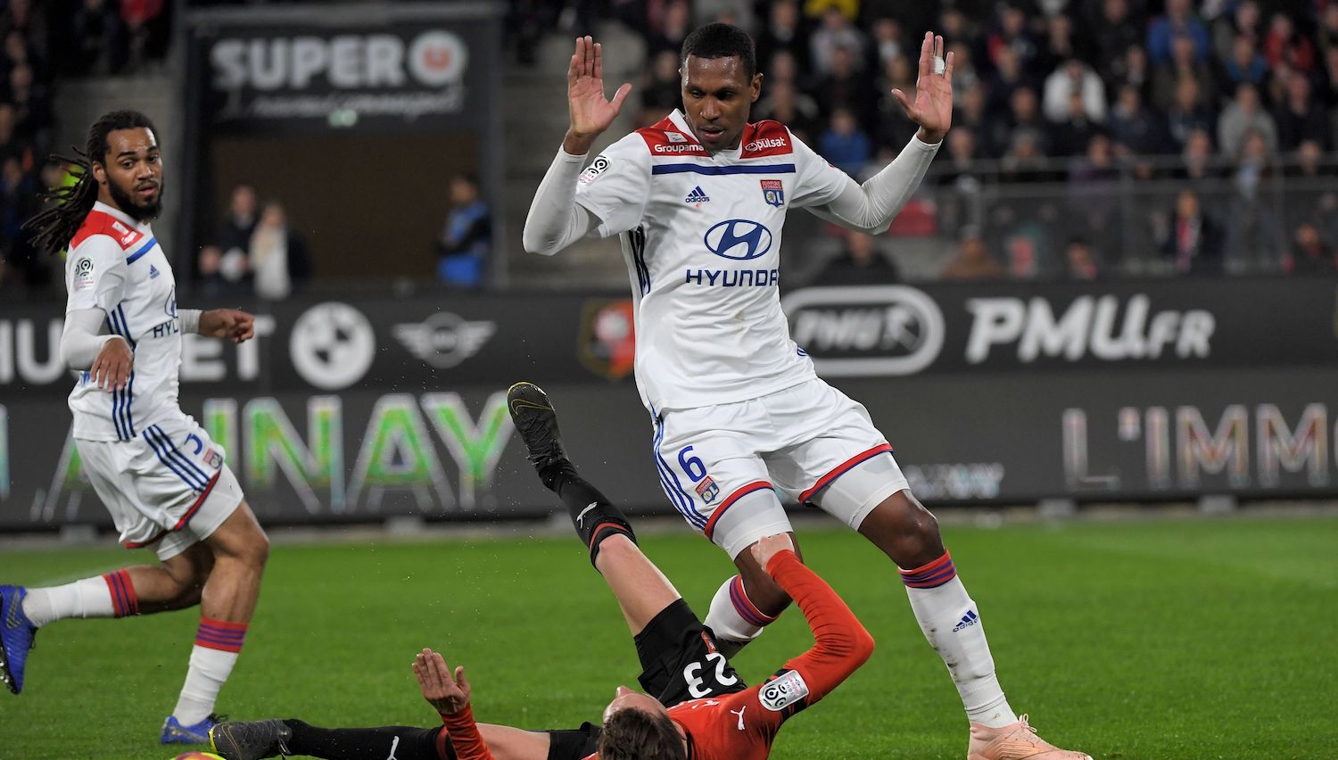 Rennes' French midfielder Adrien Hunou (L) vies with Lyon's Brazilian defender Marcelo during the French L1 football match Stade Rennais vs Olympique Lyonnais (OL), on March 29, 2019 at the Roazhon Park stadium in Rennes, western France. (Photo by LOIC VENANCE / AFP) (Photo credit should read LOIC VENANCE/AFP via Getty Images)