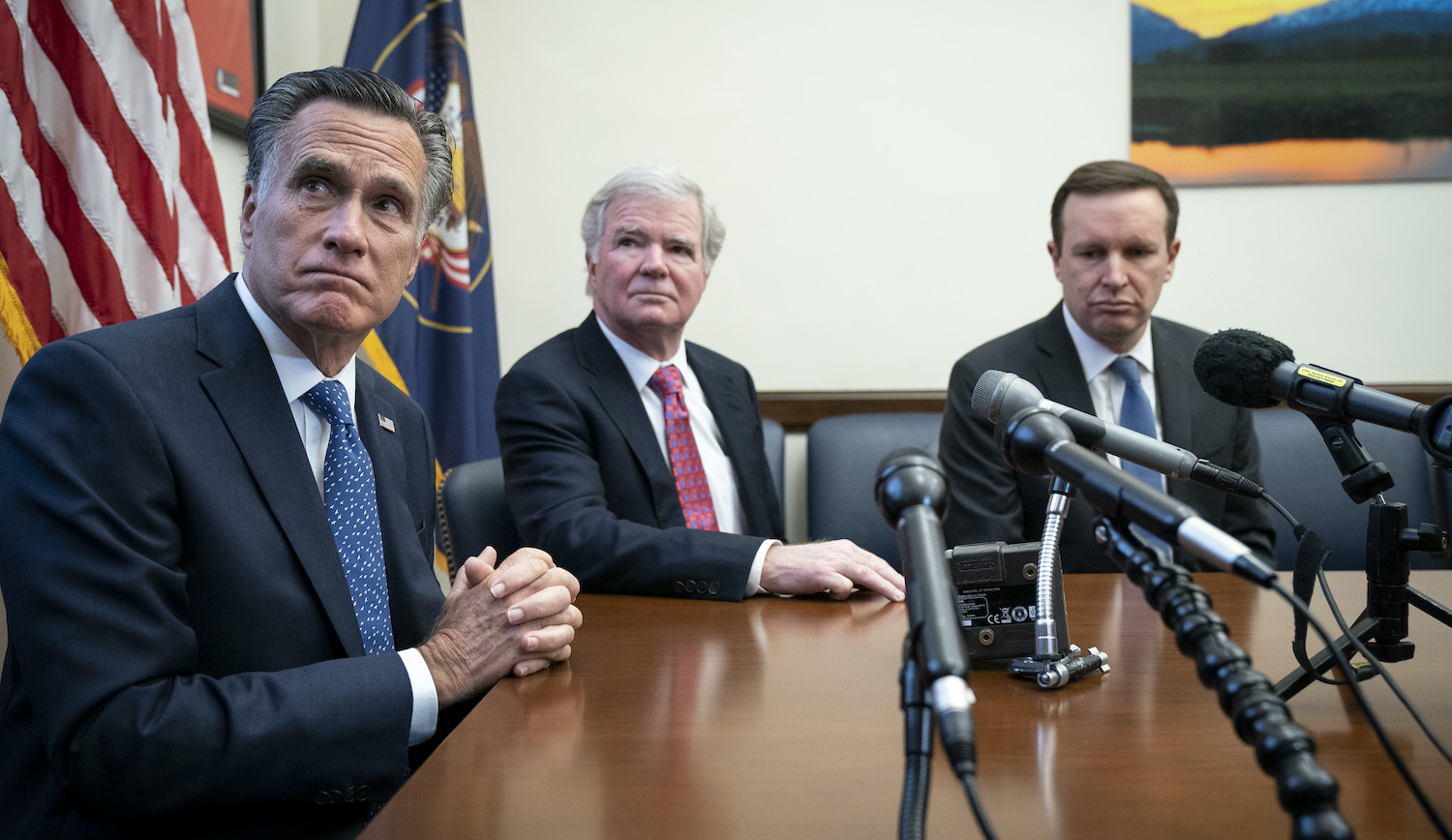 WASHINGTON, DC - DECEMBER 17: (L-R) Sen. Mitt Romney (R-UT), Mark Emmert, president of the National Collegiate Athletic Association (NCAA), and Sen. Chris Murphy (D-CT) hold a brief press availability on Capitol Hill December 17, 2019 in Washington, DC. Senators Mitt Romney (R-UT) and Chris Murphy (D-CT) met with NCAA President Mark Emmert to discuss the issue of compensation for collegiate athletes. (Photo by Drew Angerer/Getty Images)