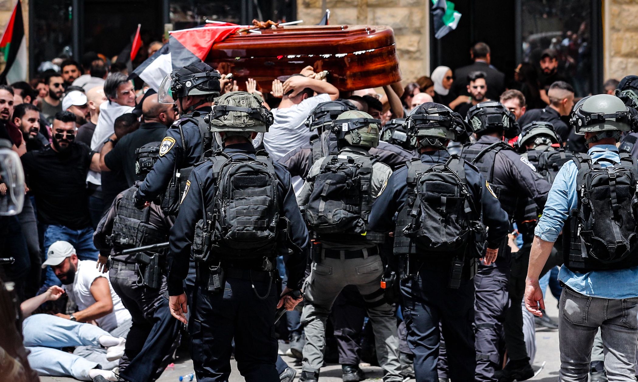 Israeli police beat Palestinian pallbearers at the funeral march of Shireen Abu Aqleh