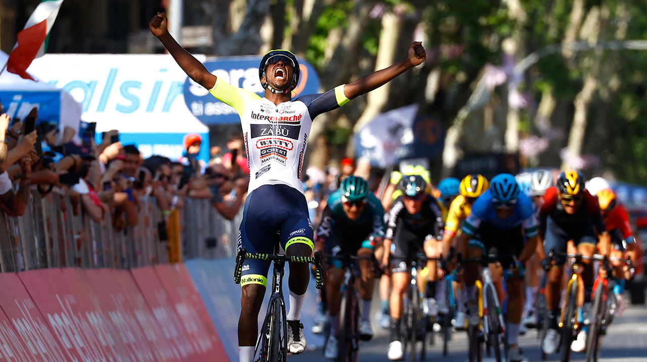 Team Wanty's Eritrean rider Biniam Girmay Hailu celebrates as he crosses the finish line to win the 10th stage of the Giro d'Italia 2022 cycling race, 196 kilometers between Pescara and Jesi, central Italy, on May 17, 2022.