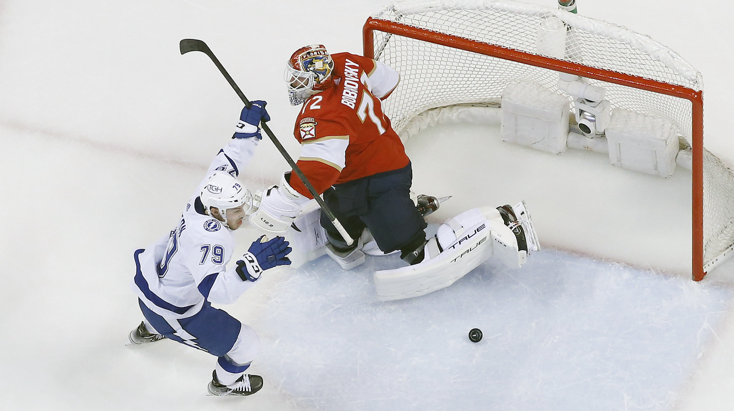 SUNRISE, FL - MAY 19: Ross Colton #79 of the Tampa Bay Lightning raises his stick after scoring the go ahead goal against Goaltender Sergei Bobrovsky #72 of the Florida Panthers in Game Two of the Second Round of the 2022 NHL Stanley Cup Playoffs at the FLA Live Arena on May 19, 2022 in Sunrise, Florida. The Lightning defeated the Panthers 2-1. (Photo by Joel Auerbach/Getty Images) *** Local Caption *** Ross Colton;Sergei Bobrovsky