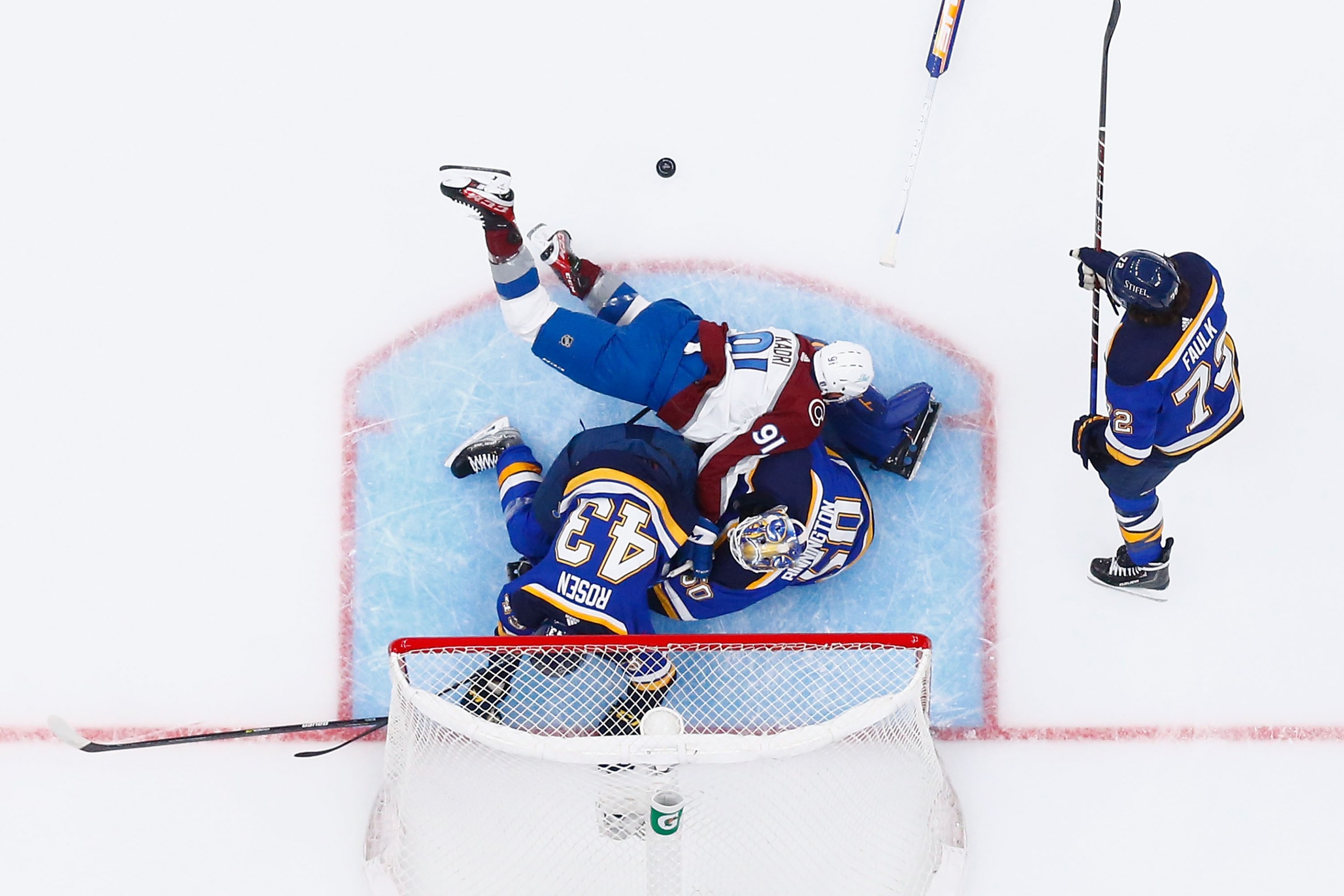 Nazem Kadri #91 of the Colorado Avalanche falls over goaltender Jordan Binnington #50 of the St. Louis Blues in the first period during Game Three of the Second Round of the 2022 Stanley Cup Playoffs at Enterprise Center on May 21, 2022 in St Louis, Missouri.