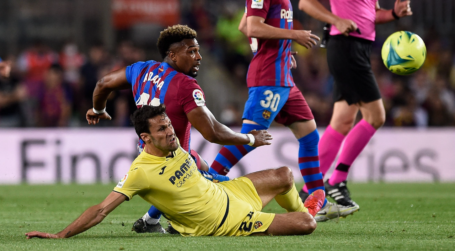 Adama Traore of Barcelona, Alfonso Pedraza of Villarreal, both going to the ground in pursuit of the ball