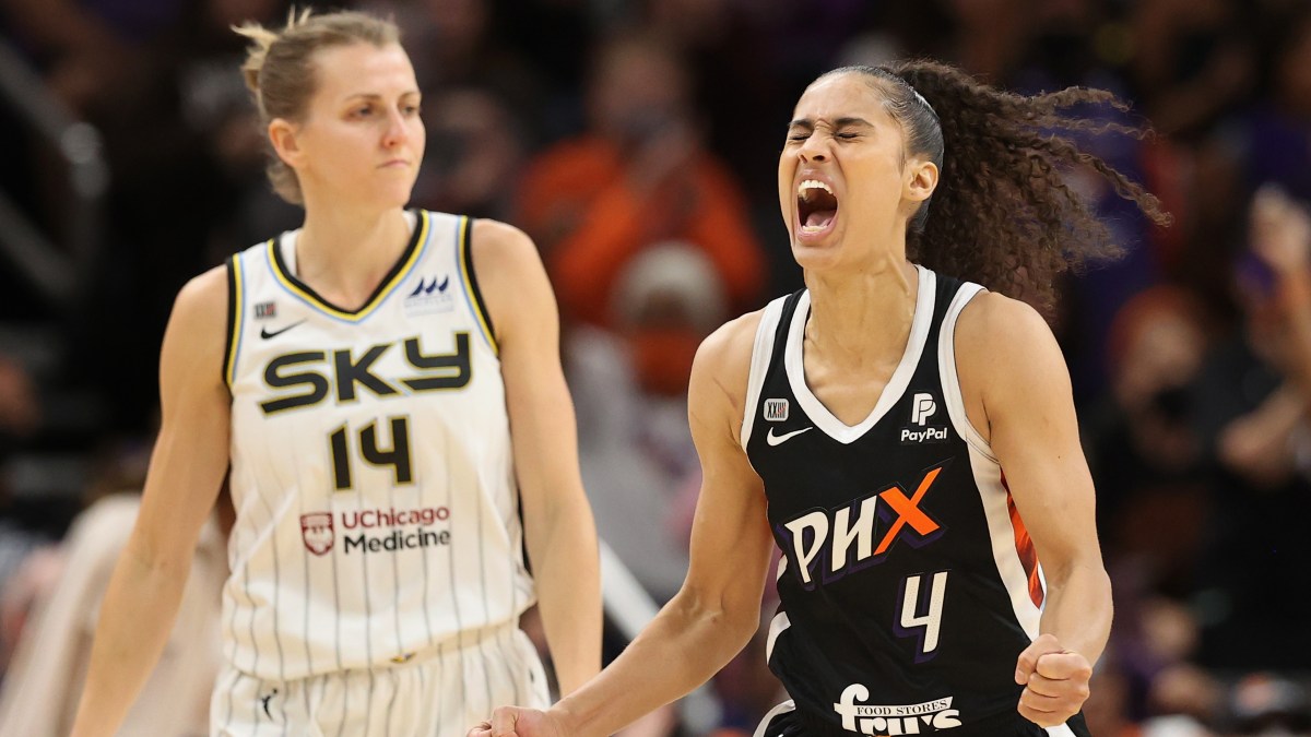 PHOENIX, ARIZONA - OCTOBER 13: Skylar Diggins-Smith #4 of the Phoenix Mercury celebrates after a turnover ahead of Allie Quigley #14 of the Chicago Sky during the second half in Game Two of the 2021 WNBA Finals at Footprint Center on October 13, 2021 in Phoenix, Arizona. The Mercury defeated the Sky 91-86 in overtime. NOTE TO USER: User expressly acknowledges and agrees that, by downloading and or using this photograph, User is consenting to the terms and conditions of the Getty Images License Agreement.