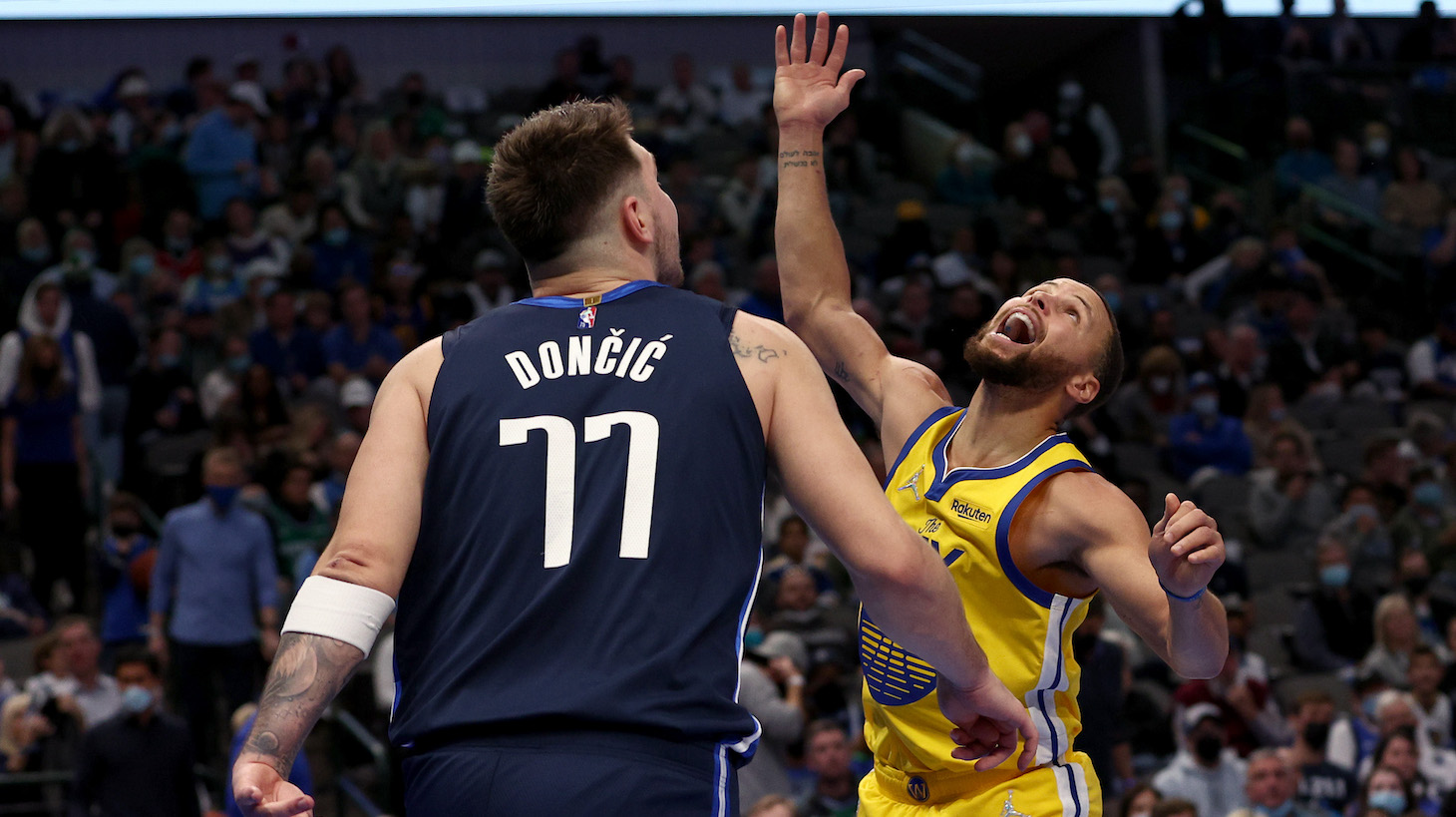 DALLAS, TEXAS - JANUARY 05: Stephen Curry #30 of the Golden State Warriors reacts after being fouled by Luka Doncic #77 of the Dallas Mavericks in the third quarter at American Airlines Center on January 05, 2022 in Dallas, Texas. NOTE TO USER: User expressly acknowledges and agrees that, by downloading and or using this photograph, User is consenting to the terms and conditions of the Getty Images License Agreement. (Photo by Tom Pennington/Getty Images)