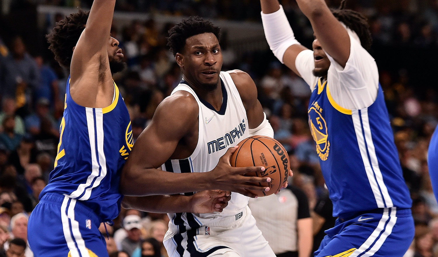 MEMPHIS, TENNESSEE - MAY 01: Jaren Jackson Jr. #13 of the Memphis Grizzlies goes to the basket against Andrew Wiggins #22 of the Golden State Warriors during Game One of the Western Conference Semifinals of the NBA Playoffs at FedExForum on May 01, 2022 in Memphis, Tennessee. NOTE TO USER: User expressly acknowledges and agrees that, by downloading and or using this photograph, User is consenting to the terms and conditions of the Getty Images License Agreement. (Photo by Justin Ford/Getty Images)