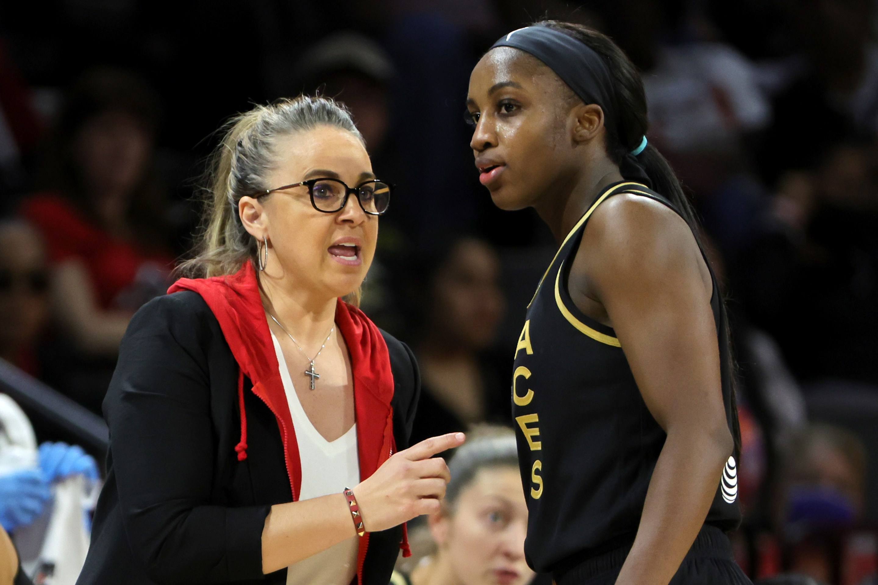 Head coach Becky Hammon of the Las Vegas Aces talks with Jackie Young #0 during their game against the Seattle Storm at Michelob ULTRA Arena on May 08, 2022 in Las Vegas, Nevada. The Aces defeated the Storm 85-74.