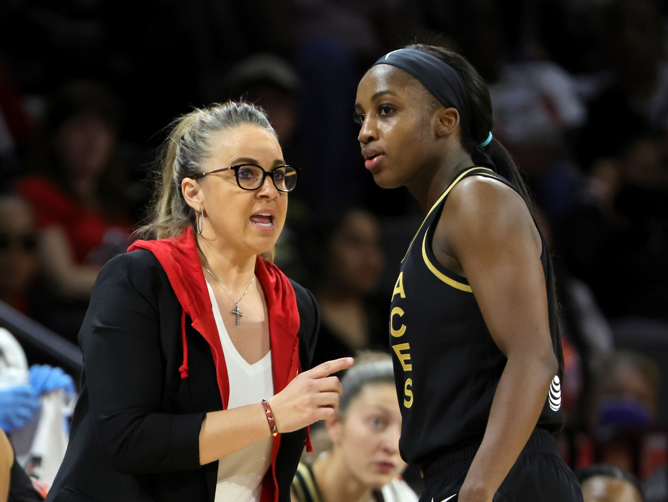 Head coach Becky Hammon of the Las Vegas Aces talks with Jackie Young #0 during their game against the Seattle Storm at Michelob ULTRA Arena on May 08, 2022 in Las Vegas, Nevada. The Aces defeated the Storm 85-74.