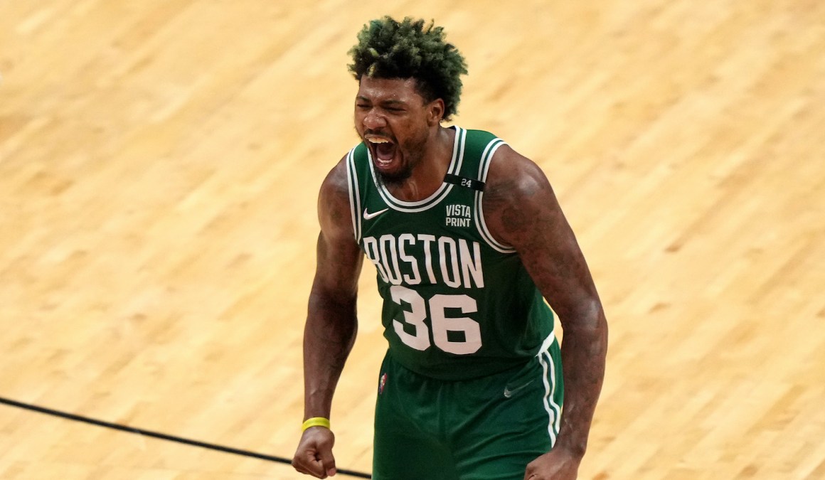 MIAMI, FLORIDA - MAY 19: Marcus Smart #36 of the Boston Celtics reacts after a three point basket during the fourth quarter against the Miami Heat in Game Two of the 2022 NBA Playoffs Eastern Conference Finals at FTX Arena on May 19, 2022 in Miami, Florida. NOTE TO USER: User expressly acknowledges and agrees that, by downloading and or using this photograph, User is consenting to the terms and conditions of the Getty Images License Agreement. (Photo by Eric Espada/Getty Images)