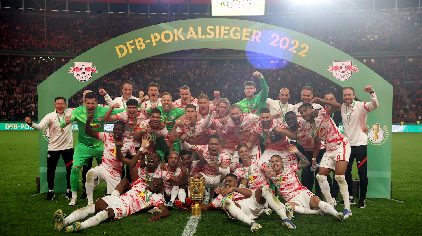 RB Leipzig players celebrate with the DFB-Pokal trophy after their sides victory during the final match of the DFB Cup 2022 between SC Freiburg and RB Leipzig at Olympiastadion on May 21, 2022 in Berlin, Germany.