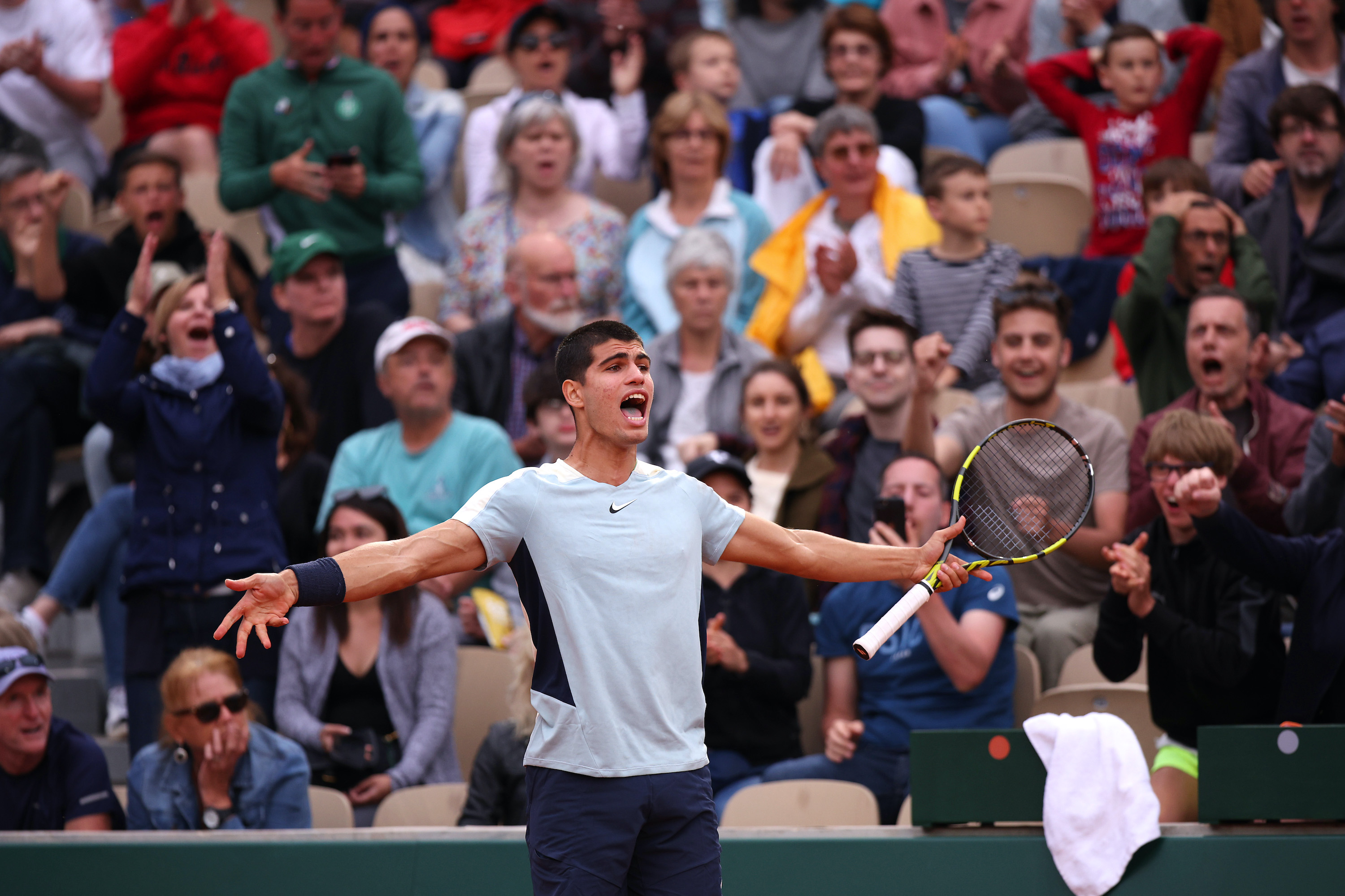 Carlos Alcaraz celebrates his second-round comeback win at Roland Garros.