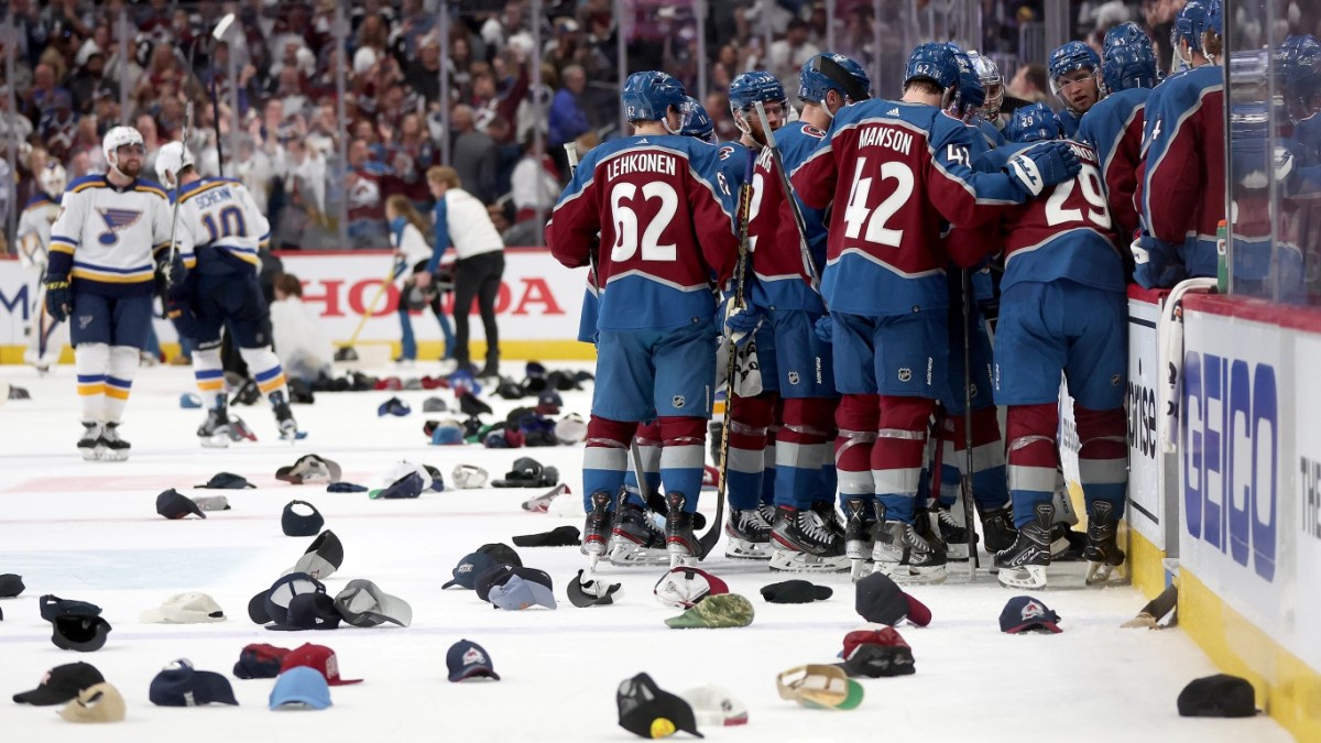 hats on the ice after Nathan MacKinnon scored his third goal