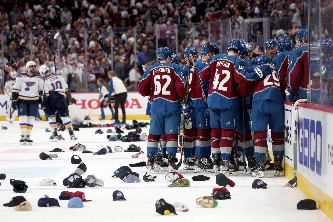 hats on the ice after Nathan MacKinnon scored his third goal
