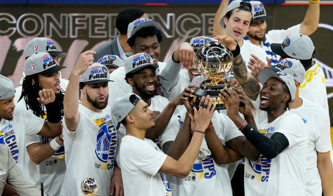 SAN FRANCISCO, CALIFORNIA - MAY 26: The Golden State Warriors hold the Western Conference Champion trophy after the 120-110 win against the Dallas Mavericks in Game Five of the 2022 NBA Playoffs Western Conference Finals at Chase Center on May 26, 2022 in San Francisco, California. NOTE TO USER: User expressly acknowledges and agrees that, by downloading and or using this photograph, User is consenting to the terms and conditions of the Getty Images License Agreement. (Photo by Thearon W. Henderson/Getty Images)