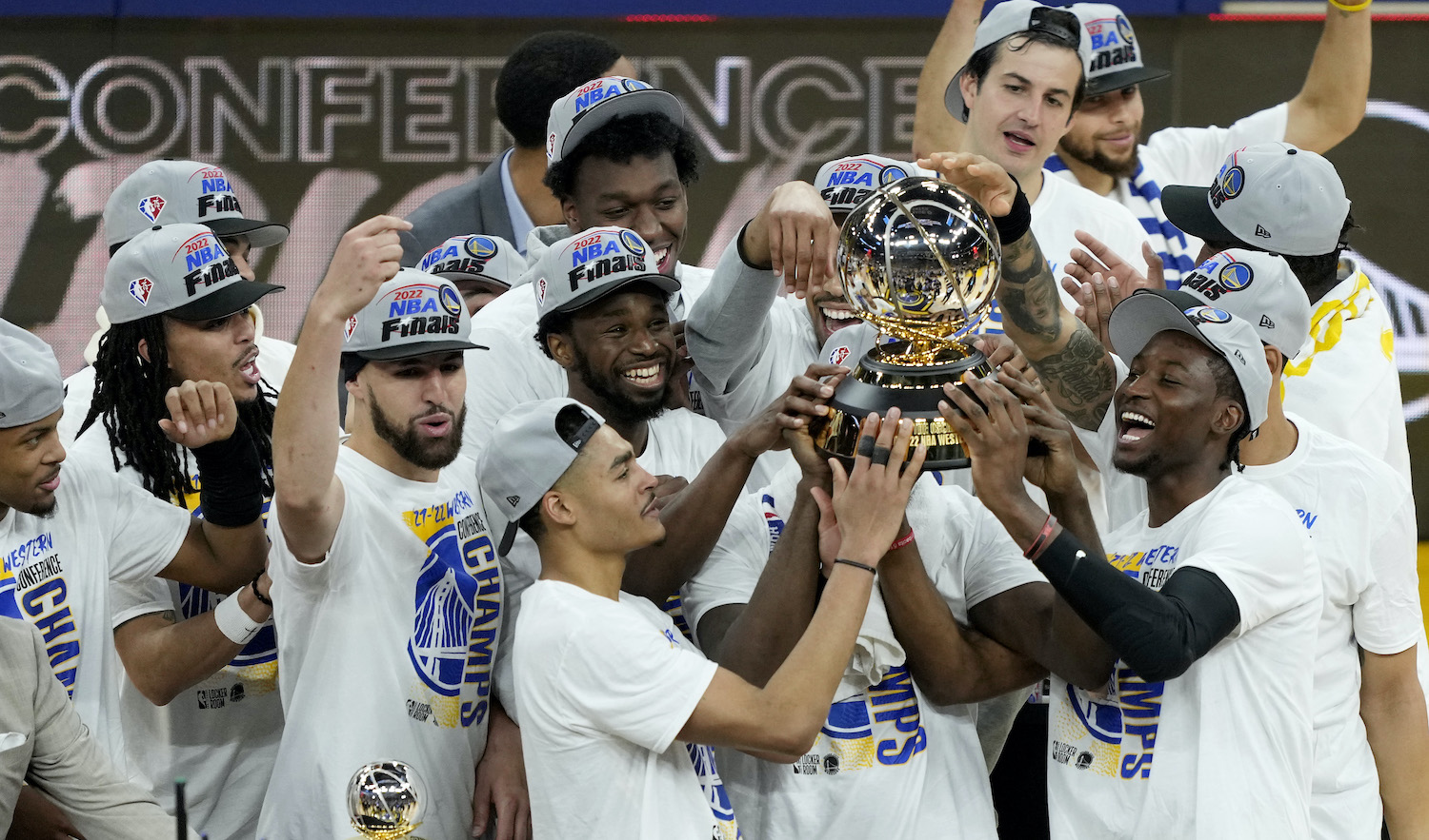 SAN FRANCISCO, CALIFORNIA - MAY 26: The Golden State Warriors hold the Western Conference Champion trophy after the 120-110 win against the Dallas Mavericks in Game Five of the 2022 NBA Playoffs Western Conference Finals at Chase Center on May 26, 2022 in San Francisco, California. NOTE TO USER: User expressly acknowledges and agrees that, by downloading and or using this photograph, User is consenting to the terms and conditions of the Getty Images License Agreement. (Photo by Thearon W. Henderson/Getty Images)