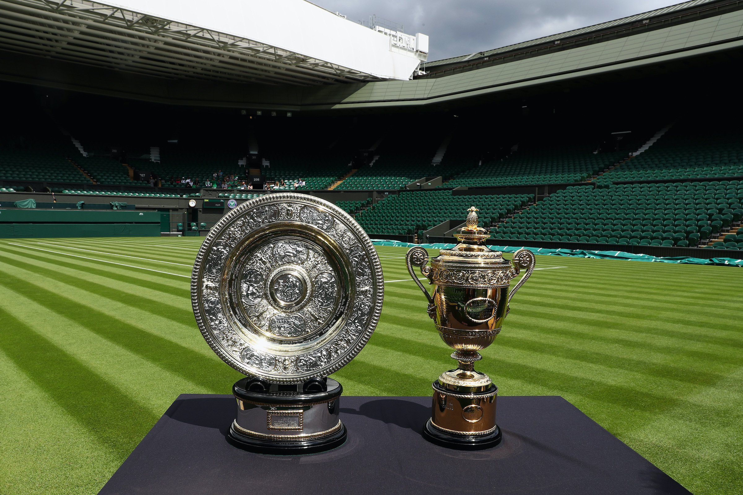 The Wimbledon trophies sit on a table.