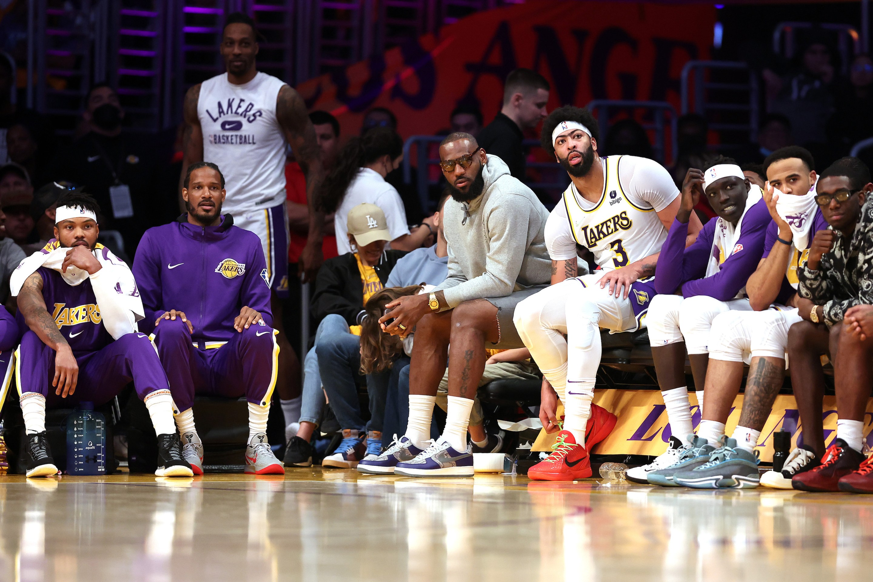 LeBron James #6 and Anthony Davis #3 of the Los Angeles Lakers look on from the bench during the second half of a game against the Denver Nuggets at Crypto.com Arena on April 03, 2022 in Los Angeles, California.